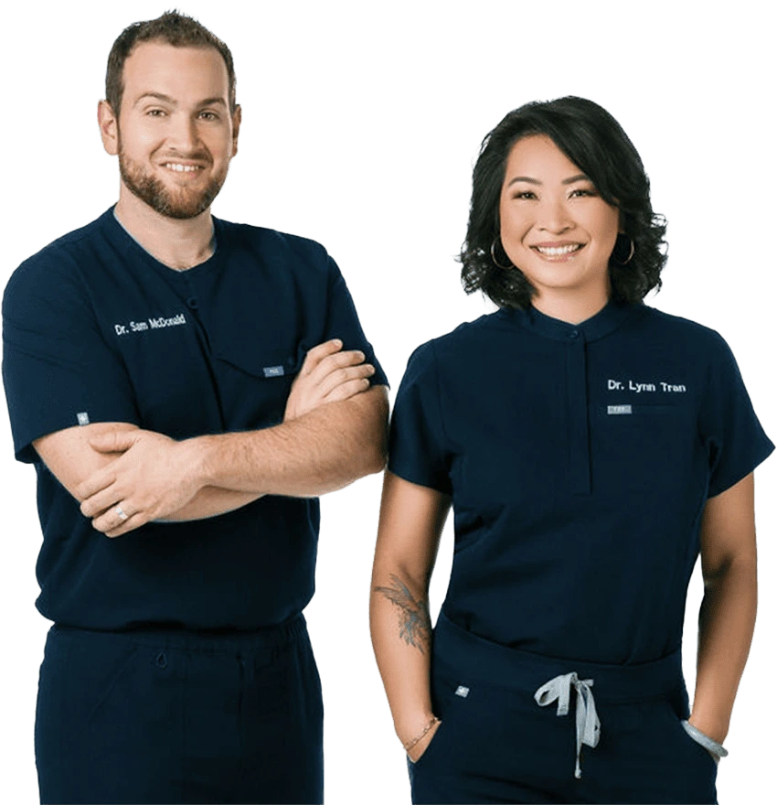 A picture of Dr. Sam and Dr. Lynn standing and smiling.