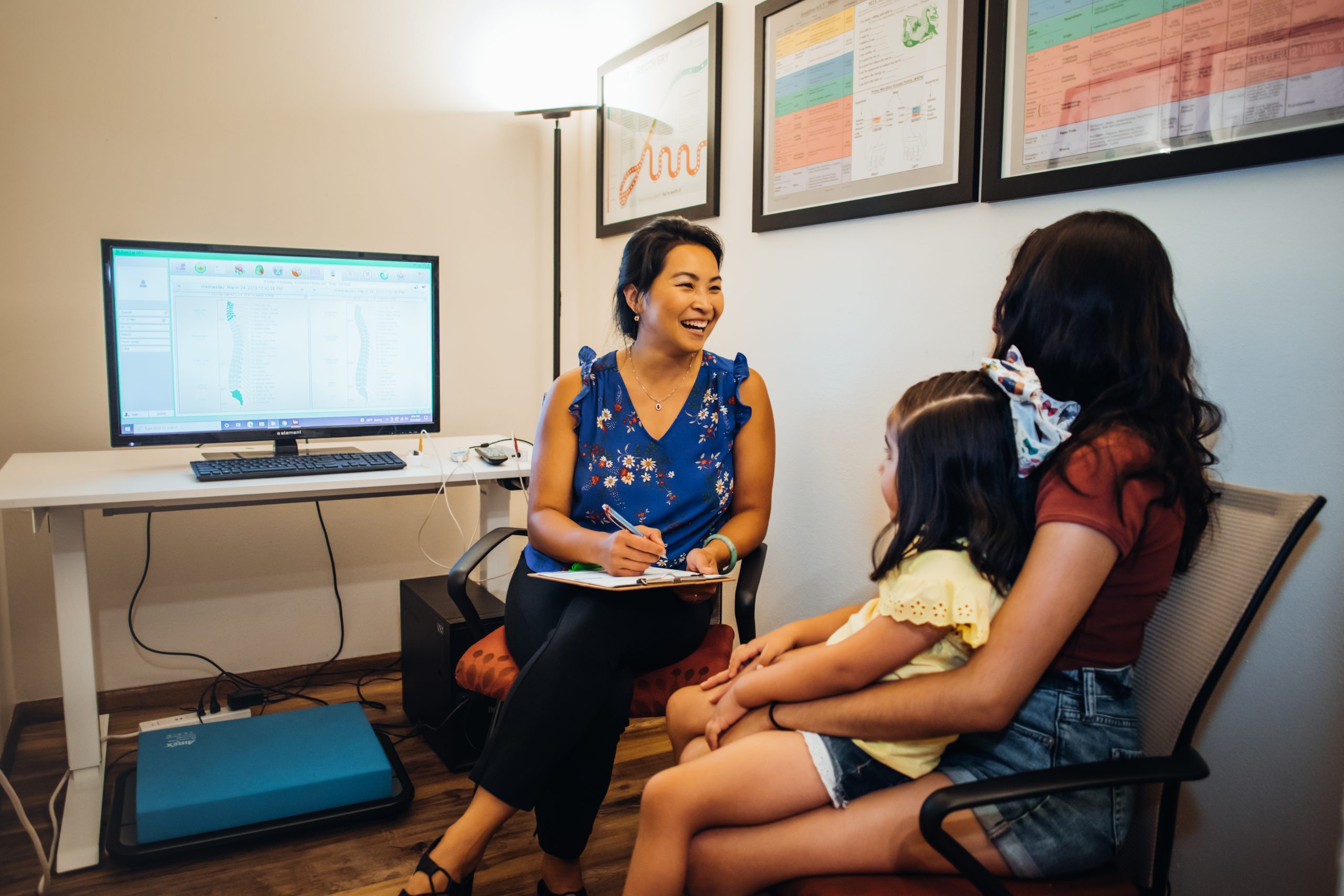 Warm in-clinic photo of Dr. Dr. Lynn with a patient or family